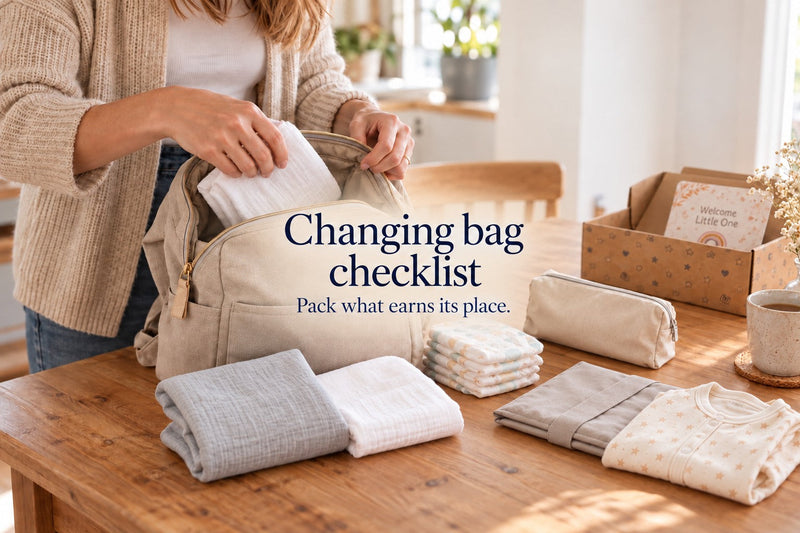 Parent packing a backpack with muslins beside nappies, changing mat and spare cotton clothes. Text: Changing bag checklist. Pack what earns its place.