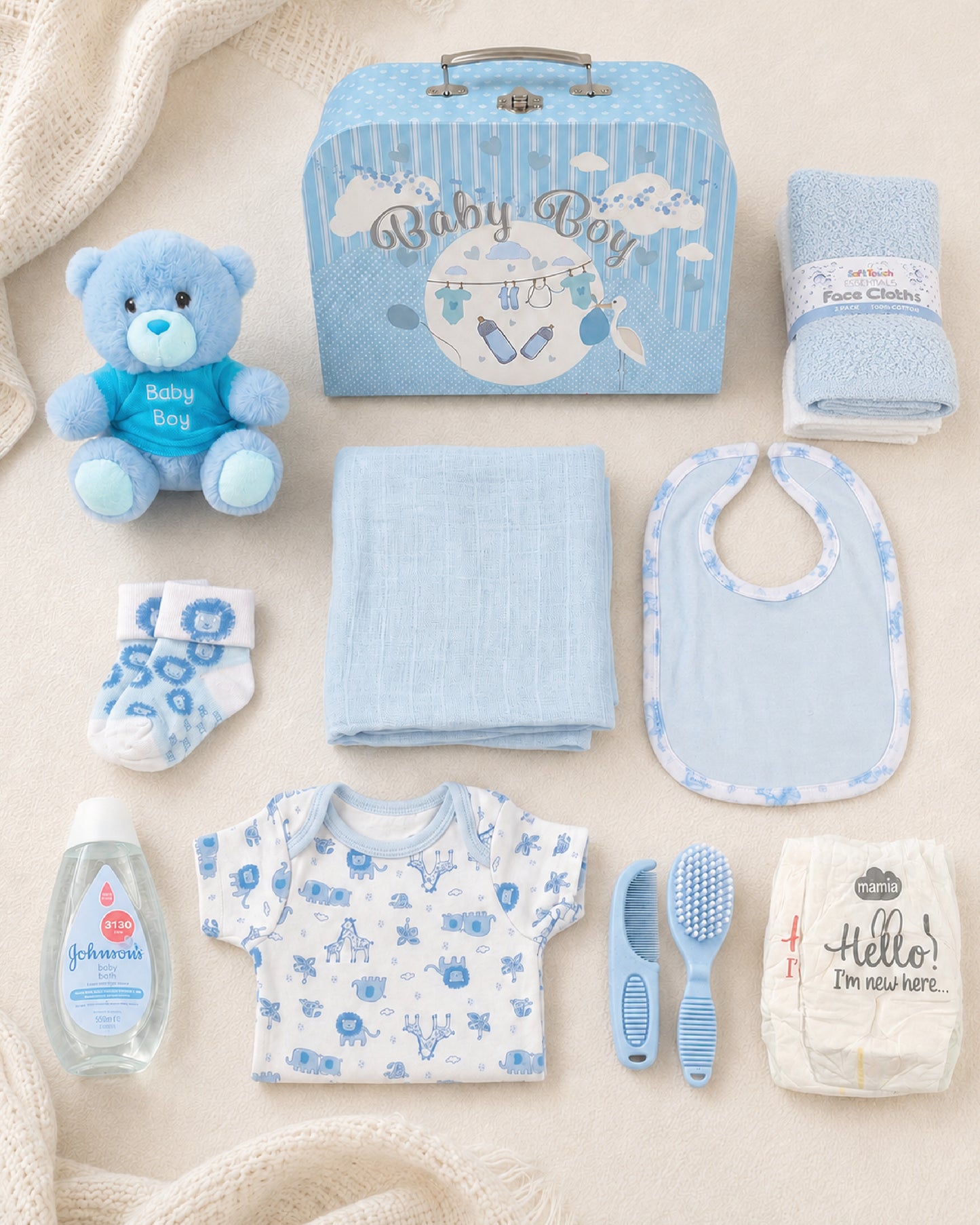 Blue , 9CM23-B , Contents Flat Lay ,

Every item laid out flat — bodysuit, bib, socks, muslin, washcloths, brush and comb, teddy bear, nappies and Johnson's bubble bath