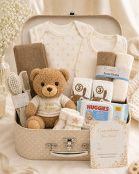 Cream , 9CM23-C , Hero Shot ,

Baby essentials gift set in a cream keepsake case with bodysuit, bib, socks, muslin, teddy bear and Huggies wipes