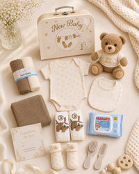 Cream , 9CM23-C , Contents Flat Lay ,

Every item laid out flat — bodysuit, bib, socks, muslin, washcloths, brush and comb, teddy bear, nappies and Huggies wipes