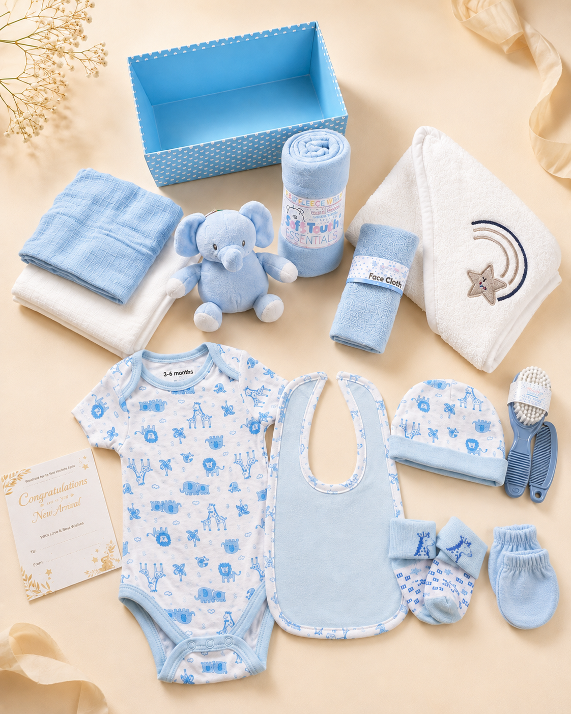 Blue - 9TR40-B - Contents of the blue hamper laid out flat, including cotton garments, muslins, washcloths, hooded towel, fleece blanket and soft toy