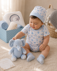 Blue - 9TR40-B - Baby holding the recycled-fibre animal soft toy from the blue hamper set