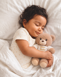 Brown , KEEL-BR , Lifestyle Shot ,

Baby hugging the brown teddy bear soft toy